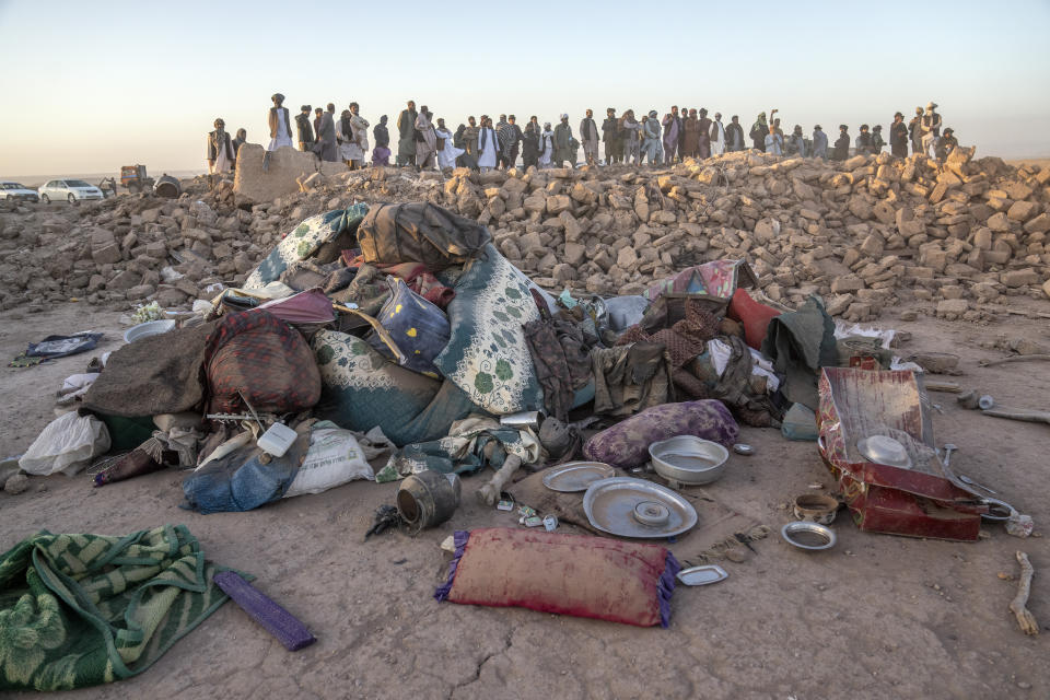 Afghan men search for victims after an earthquake in Zenda Jan district in Herat province, of western Afghanistan, Sunday, Oct. 8, 2023. Powerful earthquakes killed at least 2,000 people in western Afghanistan, a Taliban government spokesman said Sunday. It's one of the deadliest earthquakes to strike the country in two decades. (AP Photo/Ebrahim Noroozi)