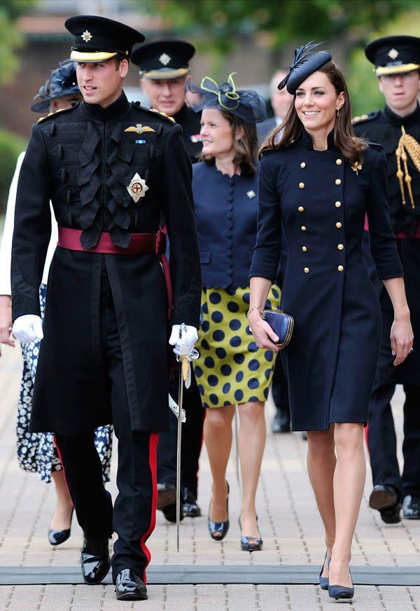 <p>Smart in a military-inspired coat by Alexander McQueen for a medal ceremony for the Irish Guard regiment</p>