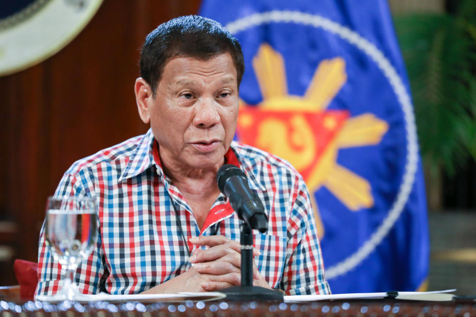 In this April 16, 2020, photo provided by the Malacanang Presidential Photographers Division, Philippine President Rodrigo Duterte speaks to the nation about the government's efforts to prevent the spread of the coronavirus that causes the COVID-19 disease during a televised address from Malacanang palace in Manila, Philippines. President Duterte threatened martial law-style enforcement of a monthlong lockdown in the main northern region of of the country as violations of the quarantine soared. (Karl Norman Alonzo/ Malacanang Presidential Photographers Division via AP)