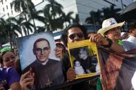 Catholics celebrate the beatification of Salvadorean archbishop Oscar Romero at the Salvador del Mundo square in San Salvador on May 23, 2015