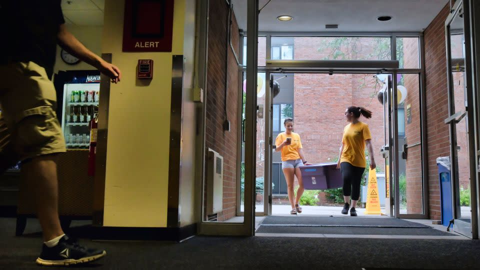 Upper class students help to carry the belongings of new students during move-in day at The College of Saint Rose on August 21, 2019, in Albany, New York. - Paul Buckowski/Albany Times Union/Getty Images