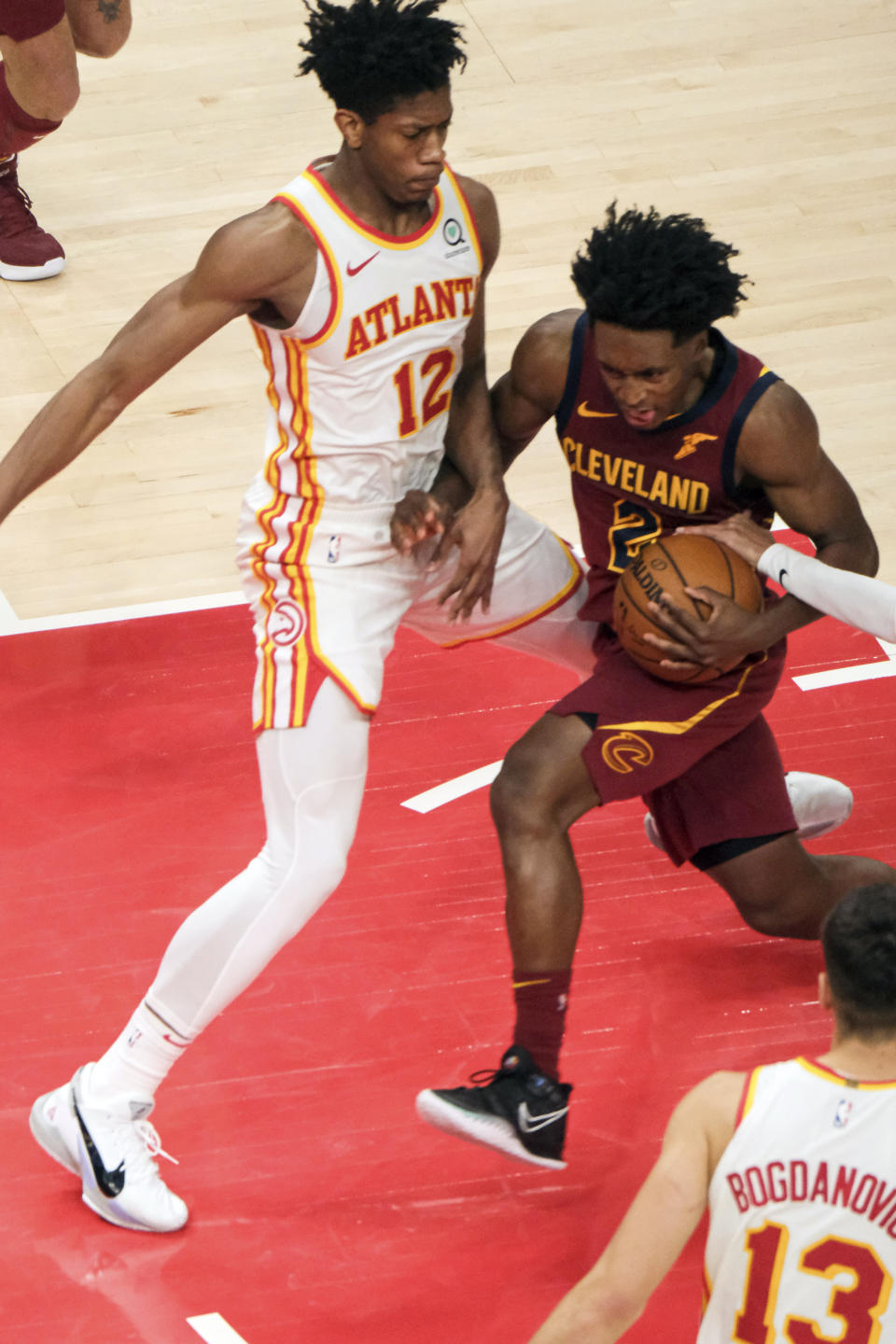 Cleveland Cavaliers guard Collin Sexton (2) drives past Atlanta Hawks forward De'Andre Hunter (12) during the second half of an NBA basketball game on Saturday, Jan. 2, 2021 in Atlanta. (AP Photo/Ben Gray)