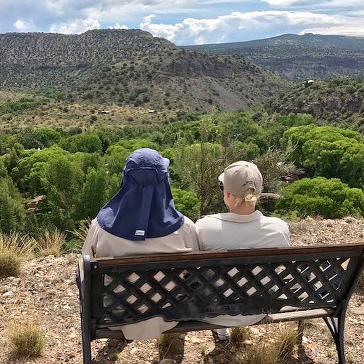 A photo of Meghan McCain and Sen. John McCain sitting together and looking out over an Arizona hillside | Meghan McCain/ Instagram