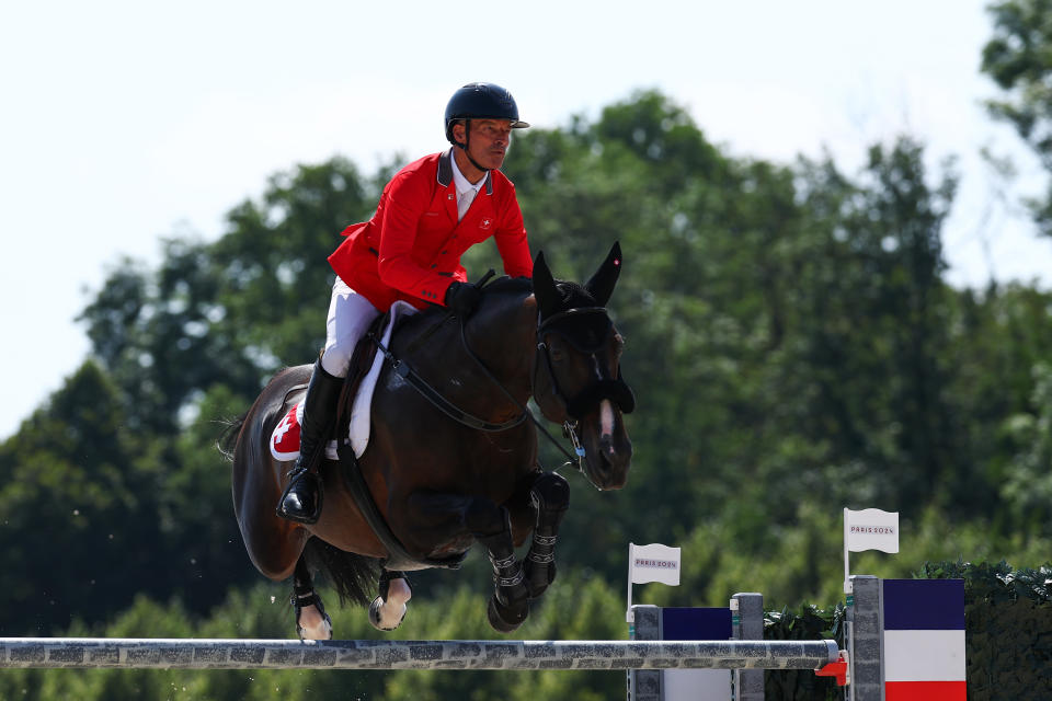 VERSAILLES, FRANCE - AUGUST 01: Pius Schwizer and horse Vancouver De Lanlore of Team Switzerland compete in the Jumping Team Qualifier on day six of the Olympic Games Paris 2024 at Chateau de Versailles on August 01, 2024 in Versailles, France. (Photo by Buda Mendes/Getty Images)