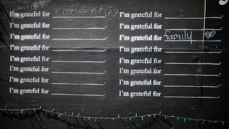 A sign has been modified to read "I will be grateful for Covid ending" amid the coronavirus disease (COVID-19) outbreak in Brattleboro, Vermont, U.S., April 19, 2020.   REUTERS/Brian Snyder