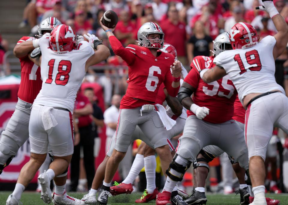 Ohio State quarterback Kyle McCord completed 14 of 20 passes for 258 passing yards and three touchdowns on Saturday.