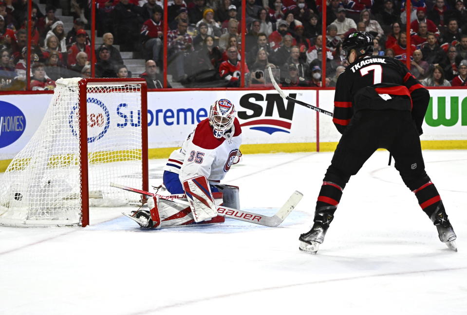 Ottawa Senators left wing Brady Tkachuk (7) watches the puck go into the net behind Montreal Canadiens goaltender Sam Montembeault (35) during the second period of an NHL hockey game in Ottawa, Ontario on Wednesday, Dec. 14, 2022. (Justin Tang/The Canadian Press via AP)