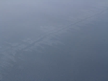 The oil spill from a stricken Iranian tanker Sanchi that sank on Sunday is seen in the East China Sea, on January 17, 2018 in this photo provided by Japan's 10th Regional Coast Guard. 10th Regional Coast Guard Headquarters/Handout via REUTERS ATTENTION EDITORS - THIS PICTURE WAS PROVIDED BY A THIRD PARTY.