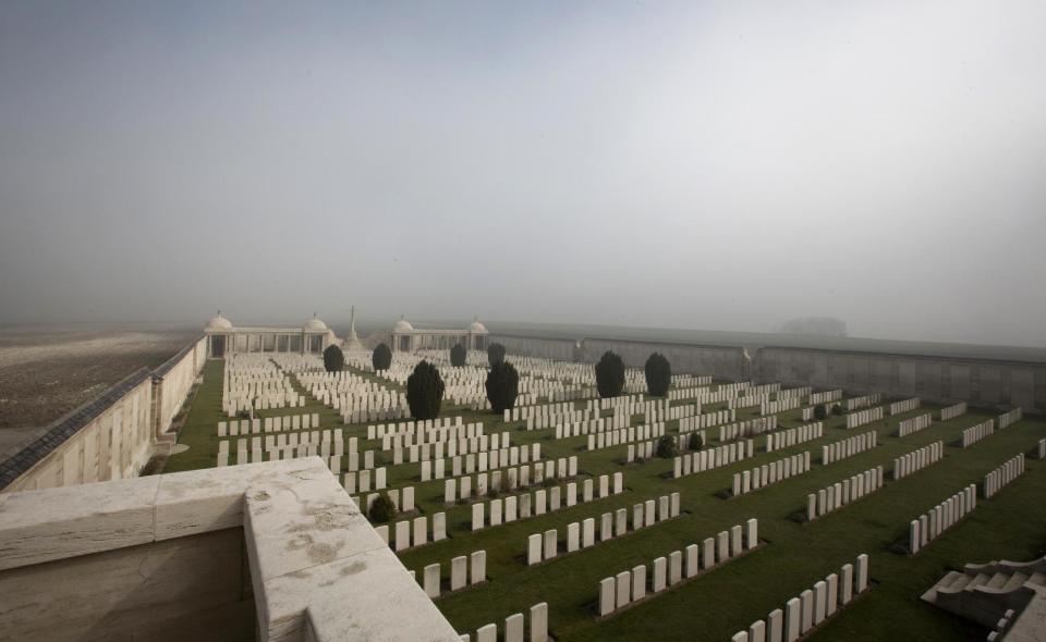 Mist gathers on the horizon at Dud's Corner World War One Cemetery in Loos-en-Gohelle, France on Thursday, March 13, 2014. Private William McAleer, of the 7th Battalion, Royal Scots Fusiliers, was killed in action on Sept. 26, 1915 during the Battle of Loos and his name has been on the wall of the missing at Dud's Corner for nearly 100 years. His body was found and identified in 2010, during routine construction in the area, and he will be reburied with full military honors at the Loos British Cemetery on Friday, March 14, 2014. (AP Photo/Virginia Mayo)