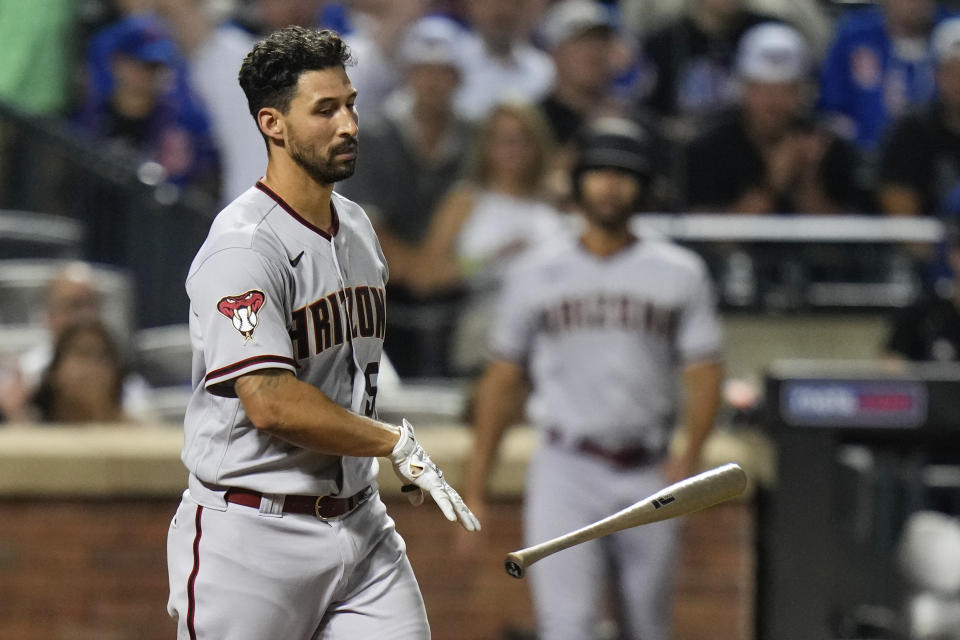 Arizona Diamondbacks' Seby Zavala tosses his bat after being hit by a pitch with the bases loaded during the eighth inning of the team's baseball game against the New York Mets, Tuesday, Sept. 12, 2023, in New York. (AP Photo/Frank Franklin II)