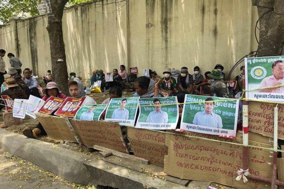 Supporters of three land rights activists protest in the Cambodian capital Phnom Penh, on Monday, May 22, 2023, to demand their release from pre-trial detention. Interior Ministry spokesperson Khieu Sopheak on Tuesday said the three members of the Coalition of Cambodian Farmers Community, who were arrested on May 17, were charged with plotting against the state because they tried to sow class divisions and incite farmers to hate the rich. (Licadho via AP)