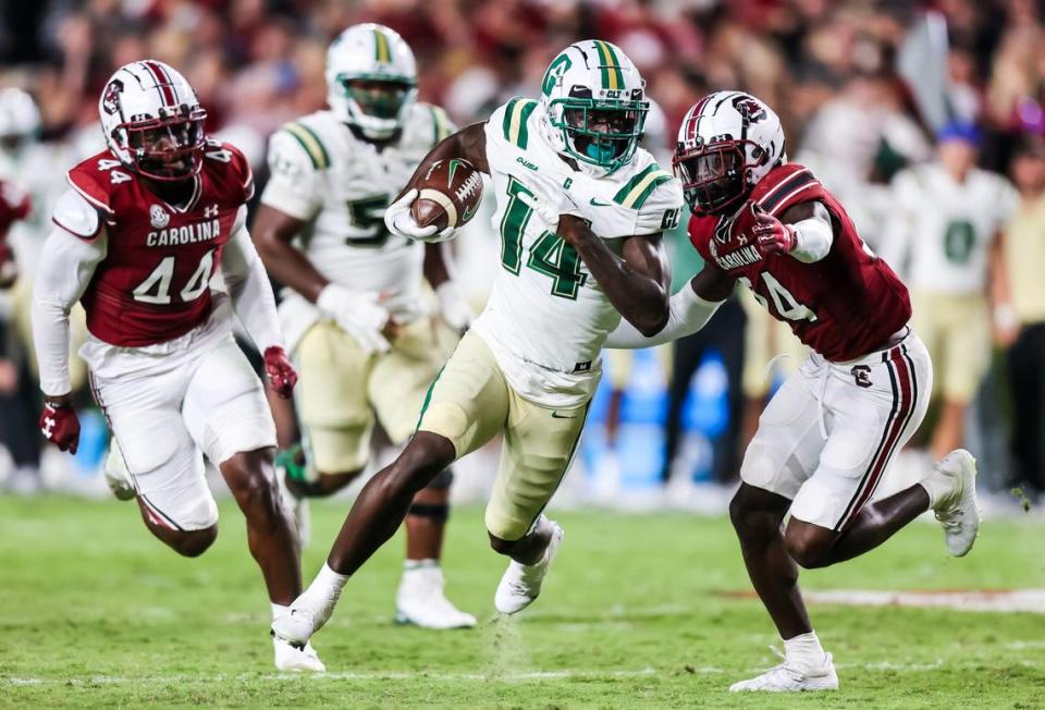 Charlotte 49ers wide receiver Grant DuBose (14) rushes past South Carolina Gamecocks defensive back Marcellas Dial (24) in the second quarter at Williams-Brice Stadium.