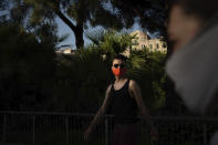 Piotr Grabarczyk, from Poland, walks at a park in Barcelona, Spain, Thursday, July 30, 2020. Grabarczyk and his boyfriend are starting over in Spain, a country that — unlike Poland — allows same-sex couples the right to marry and adopt children. Like them, many LGBT people are choosing to leave Poland amid rising homophobia promoted by President Andrzej Duda and other right-wing populist politicians in power. (AP Photo/Felipe Dana)