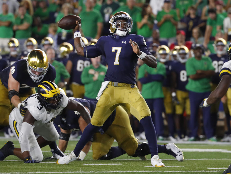 Notre Dame quarterback Brandon Wimbush (7) throws against the Michigan in the first half of an NCAA football game in South Bend, Ind., Saturday, Sept. 1, 2018. (AP Photo/Paul Sancya)