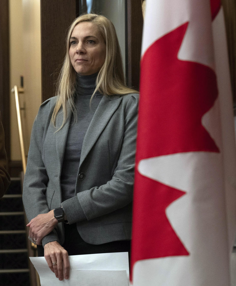 Canadian Heritage Minister Pascale St-Onge waits to speak at a microphone in the Foyer of the House of Commons, Wednesday, Nov. 29, 2023, in Ottawa, Ontario. Canada's government said Wednesday it reached a deal with Google for the company to contribute $100 million (US $74 million) annually to the country's news industry to comply with a new Canadian law requiring tech companies to pay publishers for their conten (Adrian Wyld/The Canadian Press via AP)