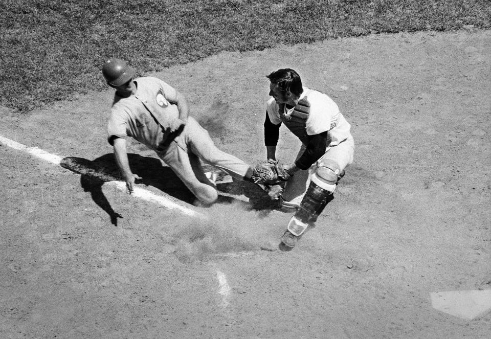 Red Wings catcher George Faros puts down the tag for the out at the plate during the Wings loss to Winnipeg, 7-2, on May 23, 1971 at Silver Stadium.