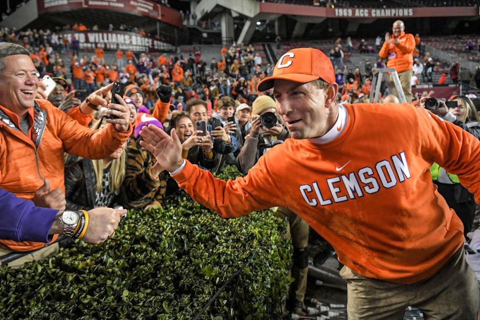 Clemson coach Dabo Swinney celebrates with fans last week after the Tigers won at South Carolina.