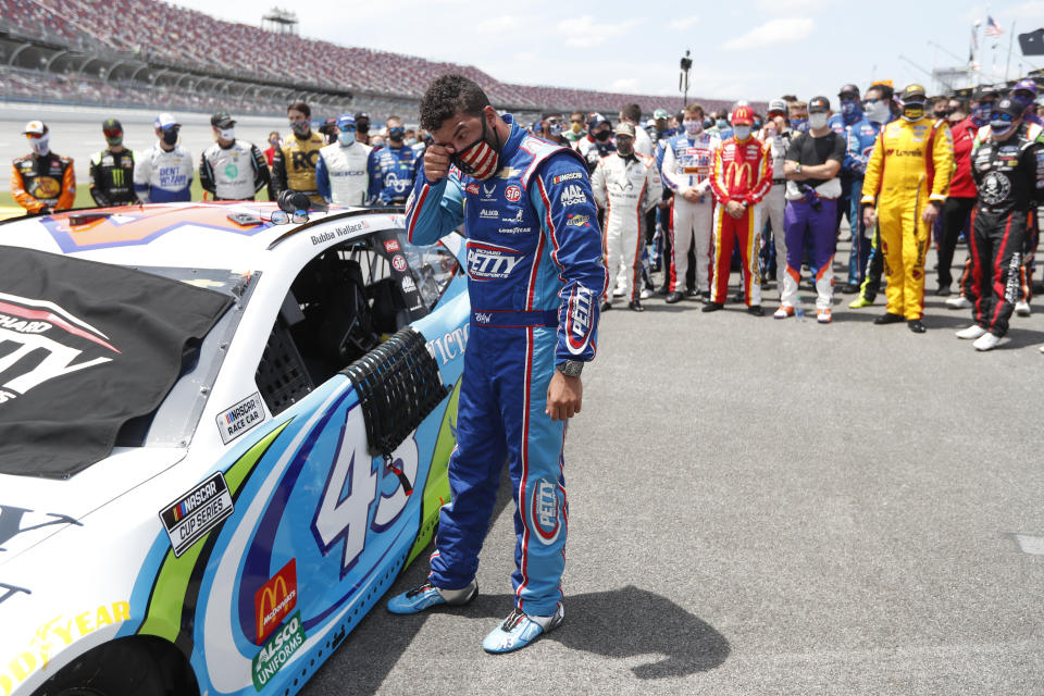 FILE - Driver Bubba Wallace is overcome with emotion prior to the start of a NASCAR Cup Series auto race at Talladega Superspeedway in Talladega, Ala., Monday, June 22, 2020. On June 21, 2020, NASCAR alerted Wallace a noose had been found in his garage stall at Talladega Superspeedway in Alabama. “RACE: Bubba Wallace," is a Netflix docuseries that chronicles the only Black driver at NASCAR's top level and his professional rise and personal role in social justice issues. (AP Photo/John Bazemore, File)