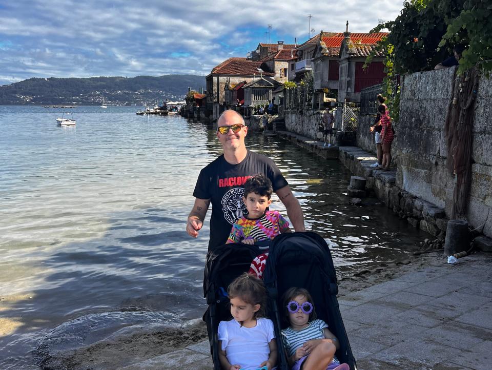 Man posing with kids for a photo