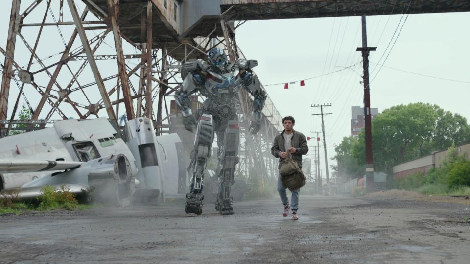 Autobot shapeshifter Mirage (voiced by Pete Davidson) befriends human electronics whiz Noah (Anthony Ramos) in "Transformers: Rise of the Beasts."