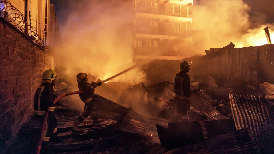 Residential buildings, businesses and cars were damaged in the blast and subsequent inferno, an official said. - Luis Tato/AFP/Getty Images