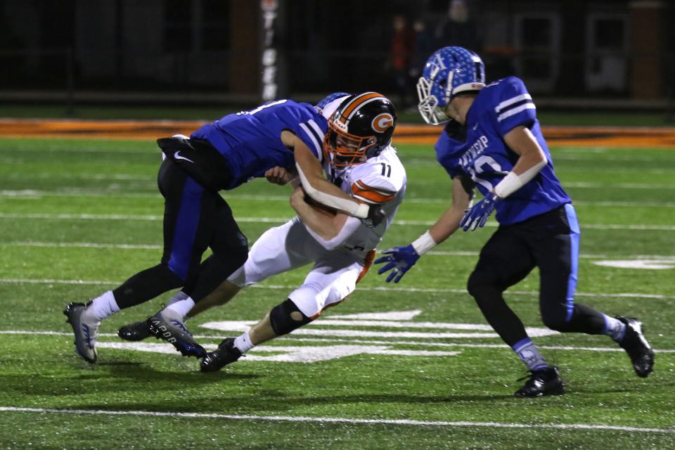 Gibsonburg's Cole Owens carries the ball. He suffered an injury on the play.