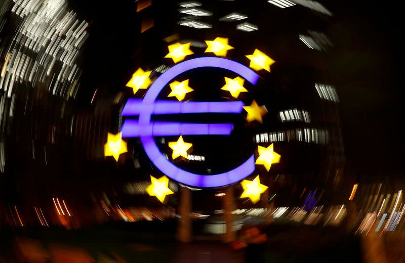 FILE PHOTO: The euro sign is photographed in front of the former head quarter of the European Central Bank in Frankfurt