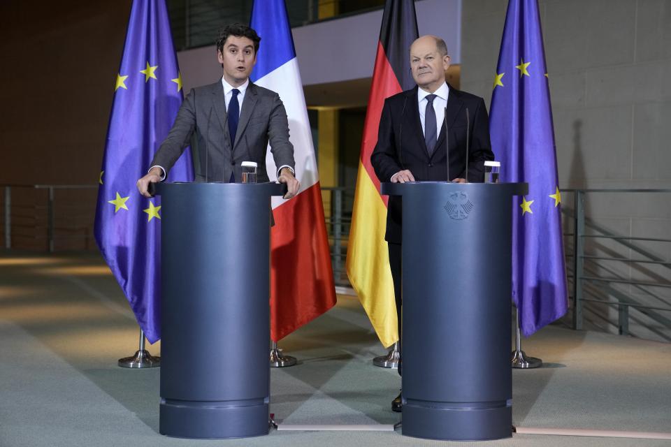 French Prime Minister Gabriel Attal, left, talks to the media beside German Chancellor Olaf Scholz, right, in Berlin, Germany, Monday, Feb. 5., 2024.(AP Photo/Ebrahim Noroozi)