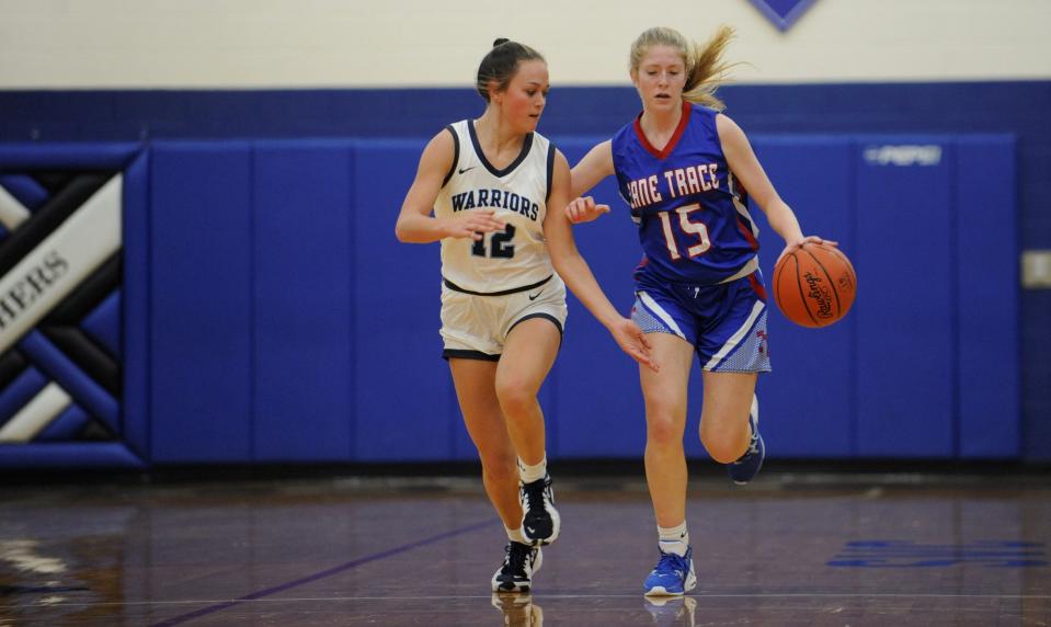 Adena sophomore Grace Townsend (#12) and Zane Trace freshman Carlie Clark (#15) move down the court during a preseason scrimmage on Nov. 11, 2022. Adena won the scrimmage 34-9.