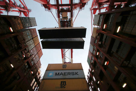 Containers are seen unloaded from the Maersk's Triple-E giant container ship Maersk Majestic, one of the world's largest container ships, at the Yangshan Deep Water Port, part of the Shanghai Free Trade Zone, in Shanghai, China, September 24, 2016. REUTERS/Aly Song
