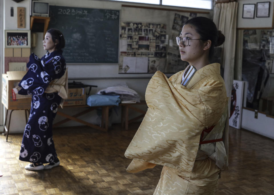 Aimi Kawasaki, right, and Eiko Moriya, Japanese traditional Hanayagi-style dance students, practice in Professor Naoko Kihara's studio in Mexico City, Friday, Nov. 24, 2023. Unlike the fast-moving interpreters of samba and salsa — widespread in Brazil and Mexico — Hanayagi dancers move quietly and gently, performing just a few moves that their bodies keep fully controlled. (AP Photo/Ginnette Riquelme)