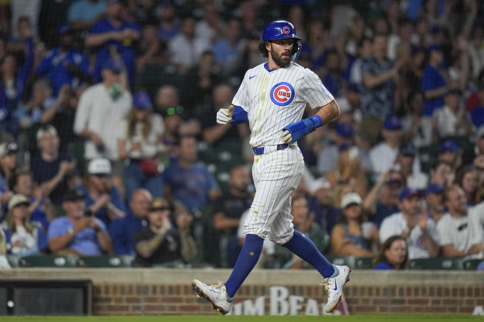 Chicago Cubs' Dansby Swanson scores on a single from Cody Bellinger during the first inning of a baseball game against the Washington Nationals, Thursday, Sept. 19, 2024, in Chicago. (AP Photo/Erin Hooley)