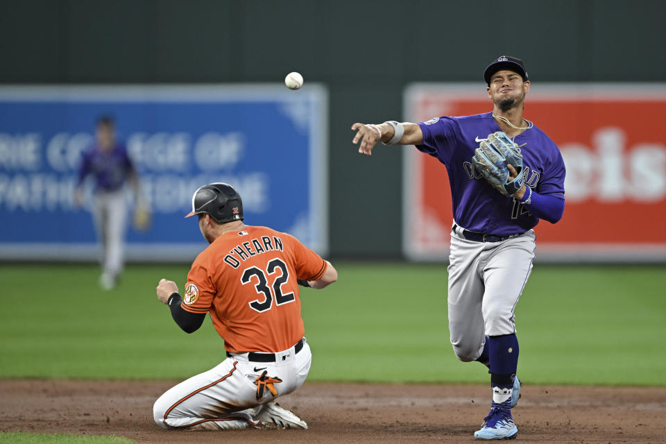 Colorado Rockies shortstop Ezequiel Tovar throws to first after forcing out Baltimore Orioles' Ryan O'Hearn during the second inning of a baseball game Saturday, Aug. 26, 2023, in Baltimore. Austin Hays was safe at first. (AP Photo/Terrance Williams)