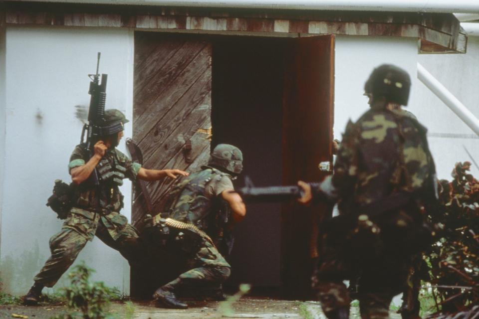 US soldiers search houses during Grenada invasion