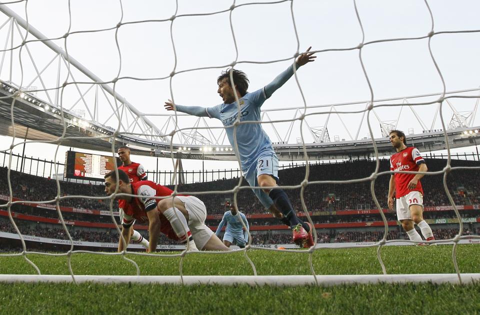 Manchester City's David Silva celebrates scoring a goal during the English Premier League soccer match between Arsenal and Manchester City at the Emirates stadium in London, Saturday, March 29, 2014. (AP Photo/Kirsty Wigglesworth)