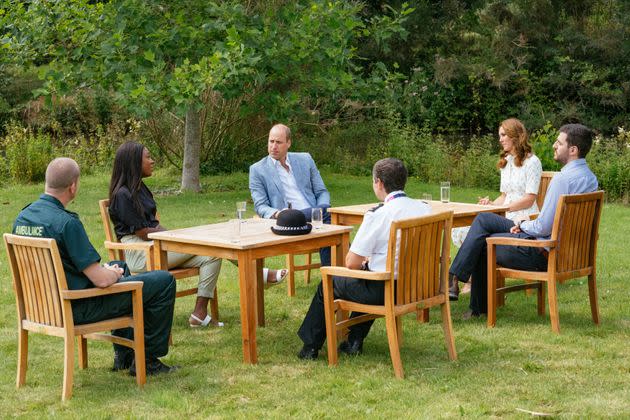 Prince William and Kate Middleton speak to representatives from groups who will receive money from the Royal Foundation's CAD $3 million fund to support frontline workers and U.K. mental health.