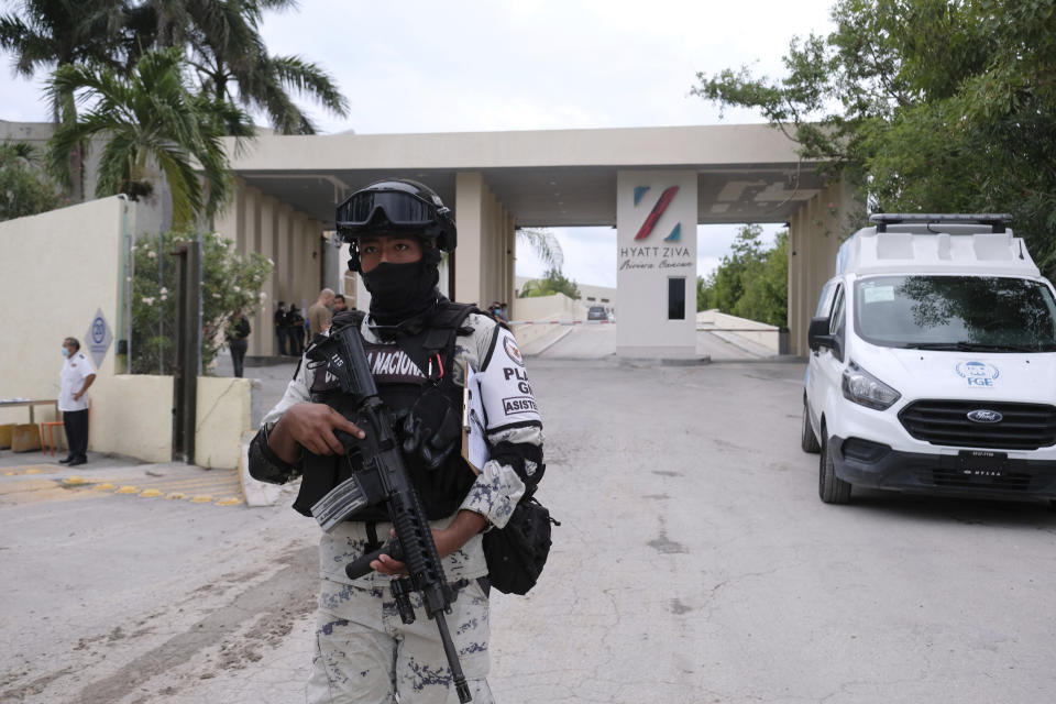 Government forces guard the entrance of hotel after an armed confrontation near Puerto Morelos, Mexico, Thursday, November 4, 2021. Two suspected drug dealers were killed after gunmen from competing gangs staged a dramatic shootout near upscale hotels that sent foreign tourists scrambling for cover. (AP Photo/Karim Torres)