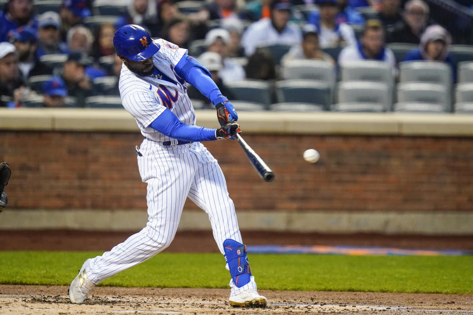 New York Mets' Starling Marte hits a double during the second inning of a baseball game against the Atlanta Braves, Monday, May 2, 2022, in New York. (AP Photo/Frank Franklin II)