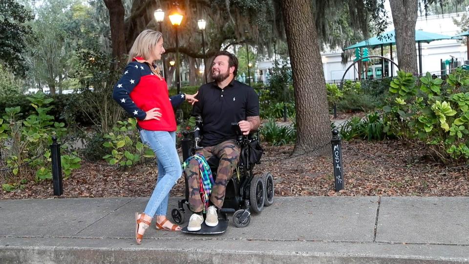 Sgt.1st Class Ryan Davis talks with his wife Asia as they watch their son Knox play at Forsyth Park in Savannah Georgia. Ryan is a triple amputee due to injuries he suffered while on a mission with the U.S. Army 1st Ranger Battalion. in August 2019.