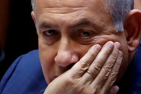 FILE PHOTO: Israeli Prime Minister Benjamin Netanyahu sits at the plenum at the Knesset, Israel's parliament, in Jerusalem