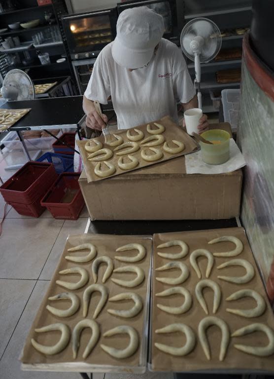 A worker prepares a traditional Slovakian delicacy, a pastry filled with poppy seeds and walnuts that dates from the 16th century, at the Fantastico pastry shop in Bratislava on December 19, 2014