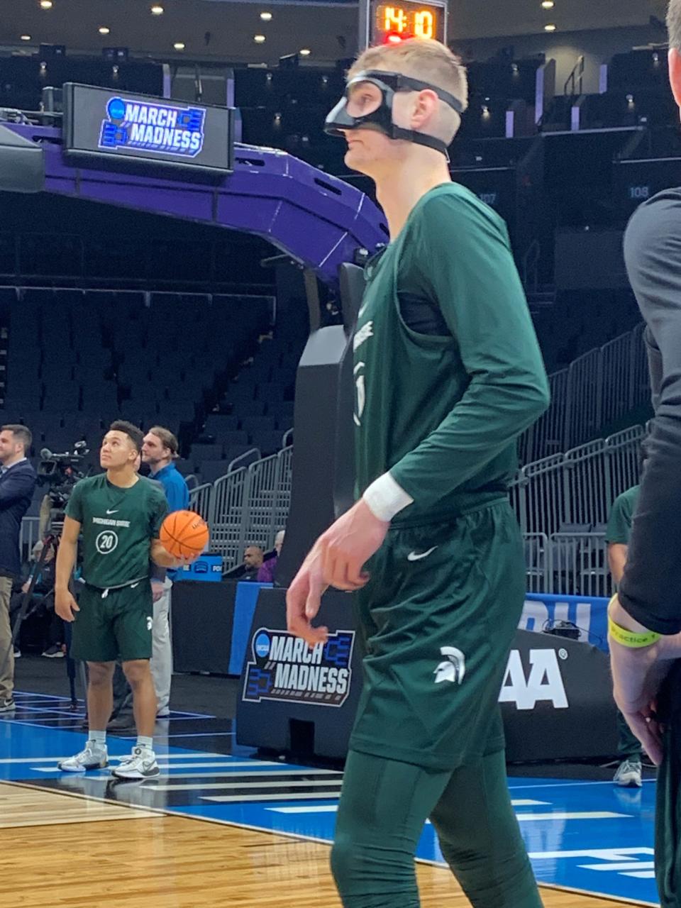 Michigan State basketball sophomore center Carson Cooper wears a mask during the Spartans' NCAA tournament practice March 20, 2024, at Spectrum Center in Charlotte, North Carolina.
