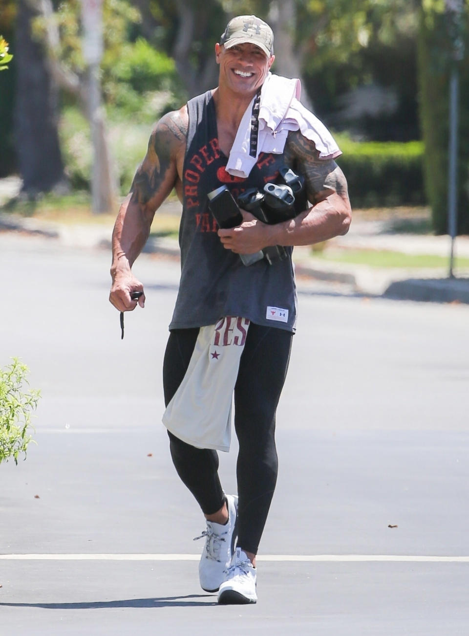 <p>Dwayne Johnson is in great spirits as he heads to the gym on July 28 in L.A. </p>