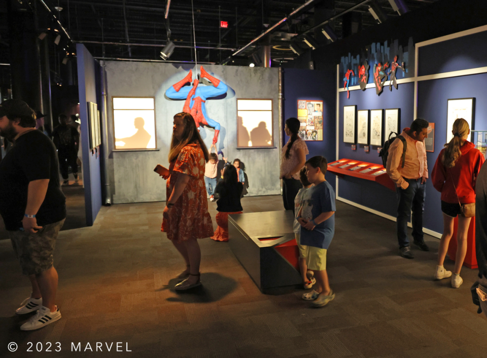 Discovery Place visitors touring the Spider-Man exhibit at Marvel: Universe of Superheroes.