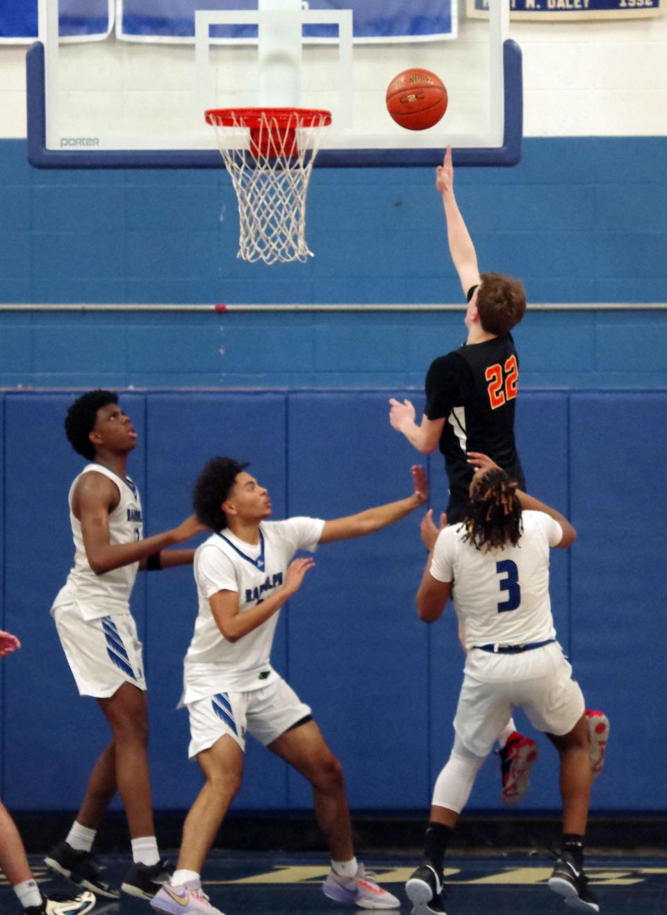 With just seconds left in the game, Matt Youngquist of Middleboro goes up and scores the shot that will seal the deal against Randolph as the Sachems beat the Blue Devils in a 45-42 thriller on Friday, Dec. 15, 2023.