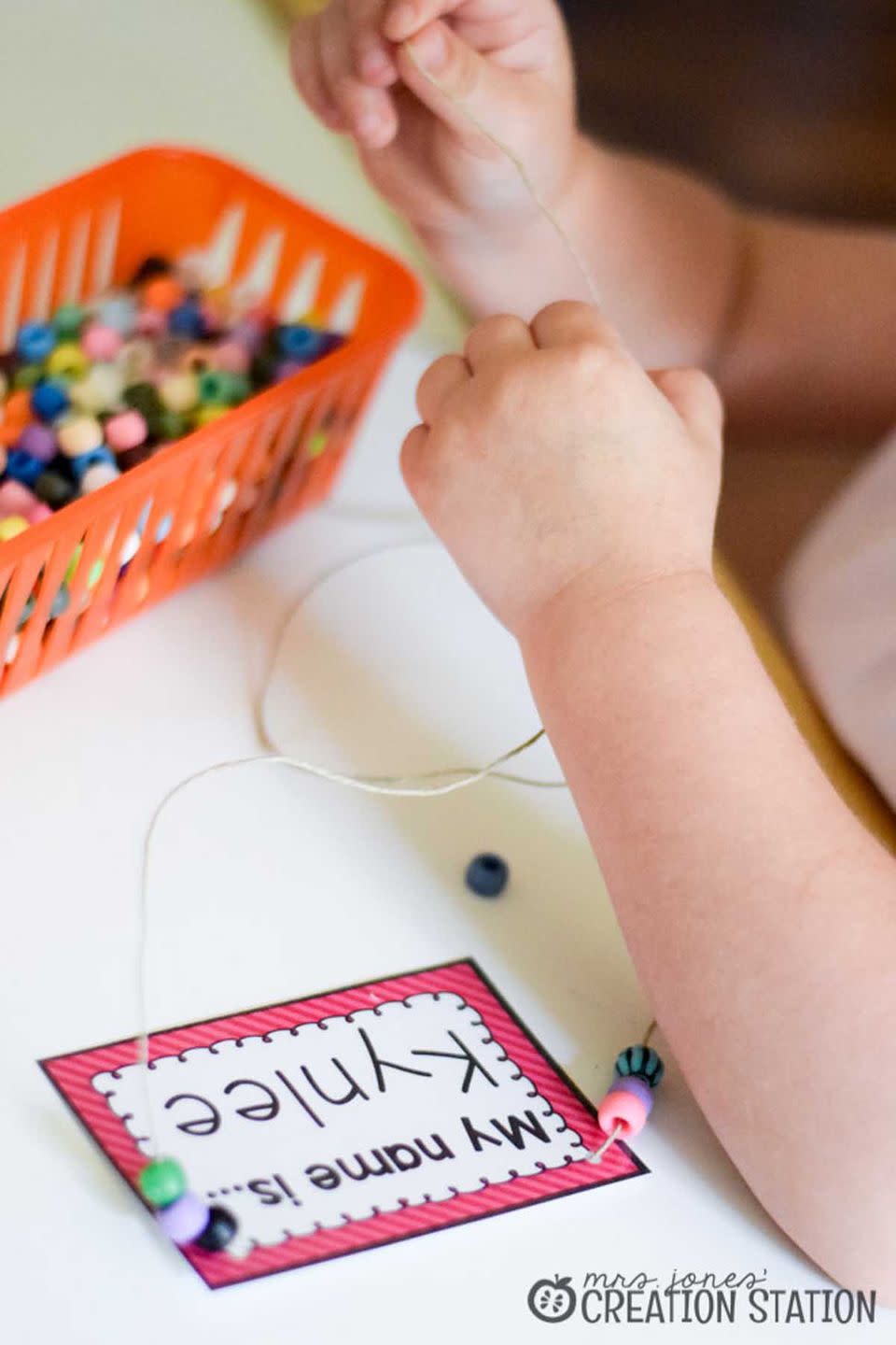 <p>Learning all your students' names isn't an easy task, so have them wear these beaded necklaces in the meantime.</p><p><em>Get the <strong><a href="https://www.mrsjonescreationstation.com/welcome-necklaces-first-day-school/" rel="nofollow noopener" target="_blank" data-ylk="slk:Welcome Name Tag Necklaces tutorial;elm:context_link;itc:0;sec:content-canvas" class="link ">Welcome Name Tag Necklaces tutorial</a></strong> at Mrs. Jones' Creation Station. </em></p><p><a class="link " href="https://www.amazon.com/Scotch-Self-Sealing-Laminating-Pouches-LS853-5G/dp/B002Q0YD28/?tag=syn-yahoo-20&ascsubtag=%5Bartid%7C10070.g.3123%5Bsrc%7Cyahoo-us" rel="nofollow noopener" target="_blank" data-ylk="slk:SHOP NAME TAGS;elm:context_link;itc:0;sec:content-canvas">SHOP NAME TAGS</a> </p>