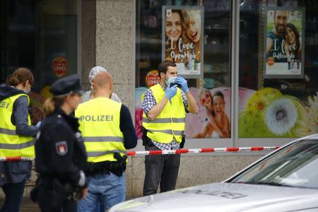 Police investigators work at the crime scene after a knife attack in a supermarket in Hamburg, Germany, July 28, 2017. REUTERS/Morris Mac Matzen