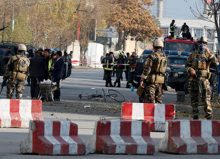 Afghan policemen inspect the site of a blast in Kabul, Afghanistan November 12, 2018. REUTERS/Omar Sobhani