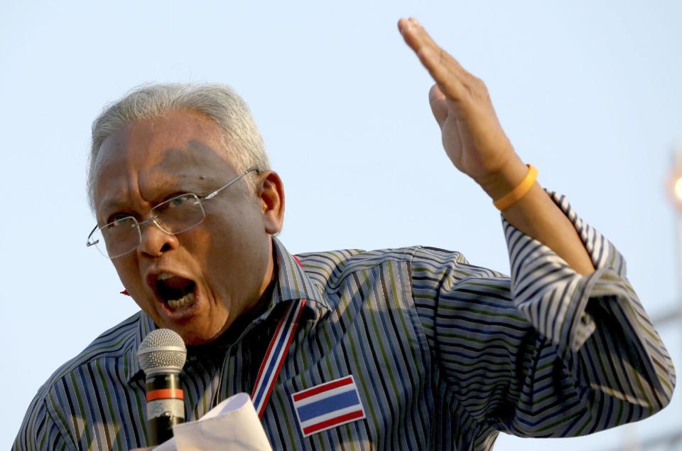 Anti-government protest leader Suthep Thaugsuban addresses supporters during a rally Friday, Jan. 17, 2014 in Bangkok. Dozens of people were wounded in Thailand's capital Friday when a grenade blast ripped through a crowd of marching anti-government demonstrators, an ominous development that raises tensions in the country's political crisis and the specter of more bloodshed to come. (AP Photo/Apichart Weerawong)