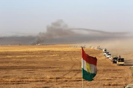 A Kurdish flag is seen on a military vehicles of the Kurdish Peshmerga forces on the southeast of Mosul , Iraq, August 14, 2016. REUTERS/Azad Lashkari